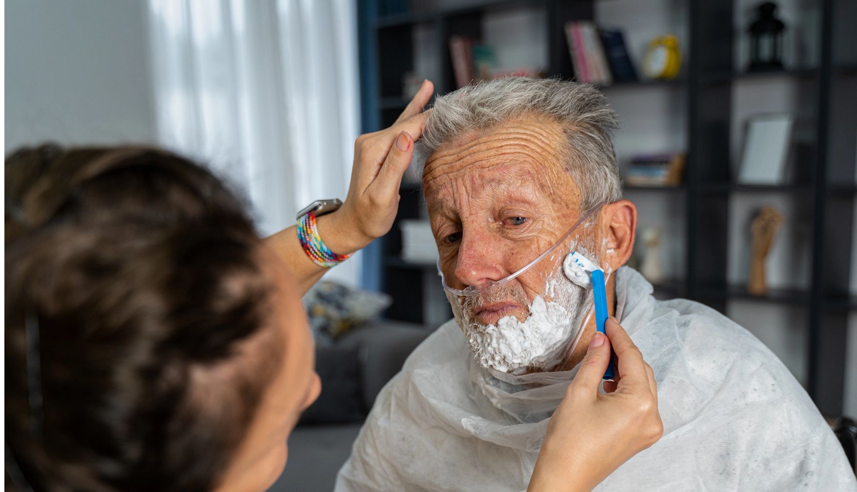 Home health aide helping a patient with supportive in-home care