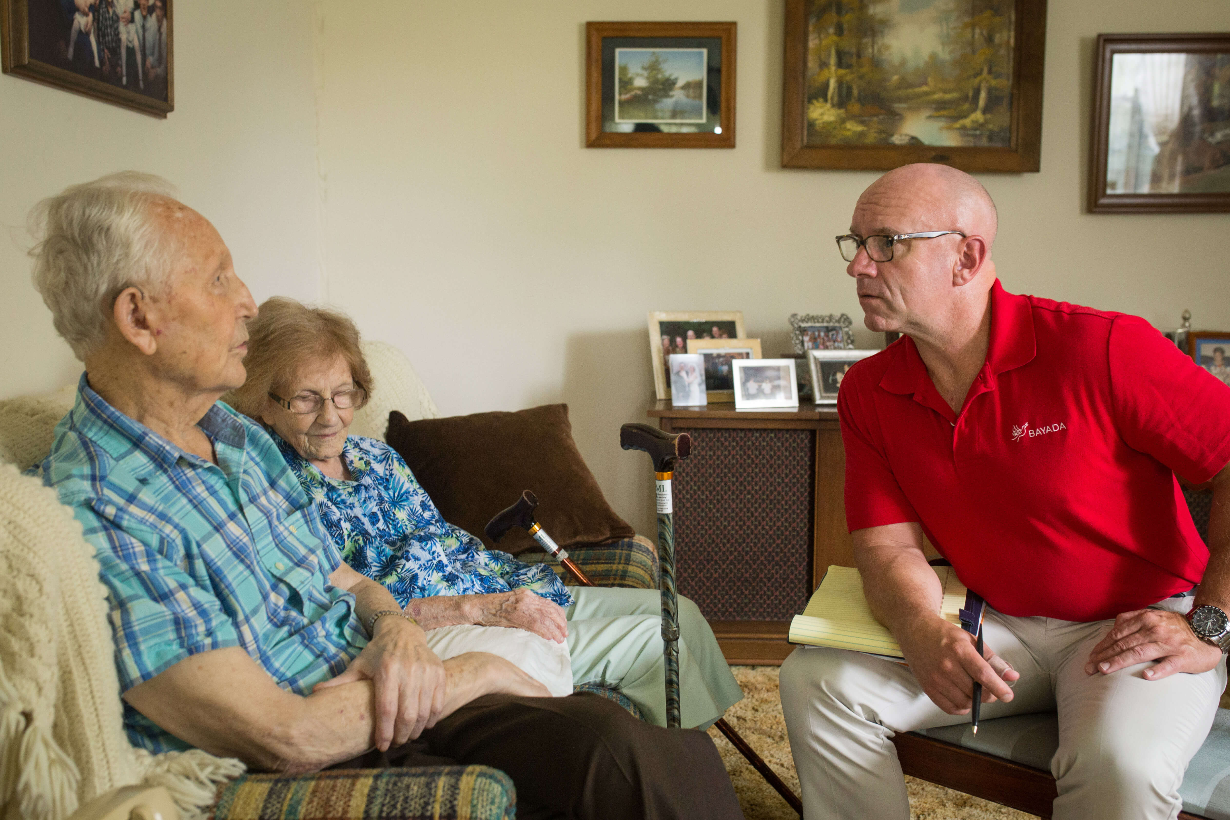 Medical social worker providing support and guidance to a family at home