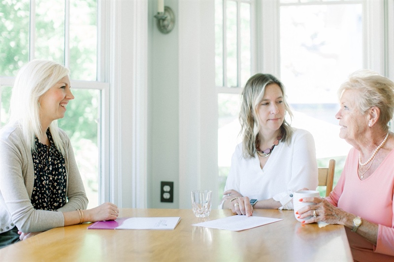 Medical social worker meeting with a patient and family at home
