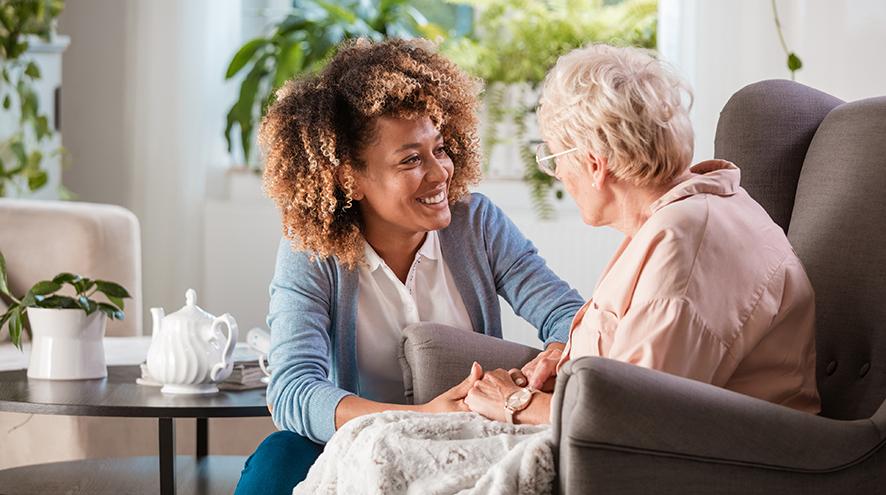 Nurse providing in-home medical care to a patient